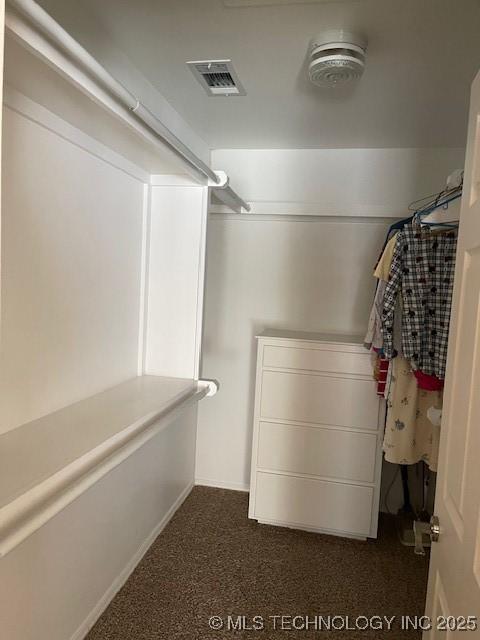 walk in closet with visible vents