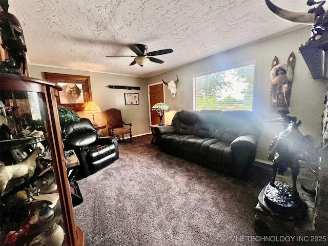 living room featuring ceiling fan, carpet flooring, and a textured ceiling