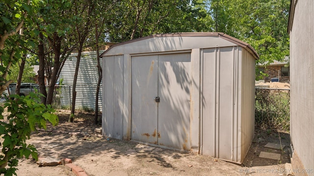 view of shed with a fenced backyard