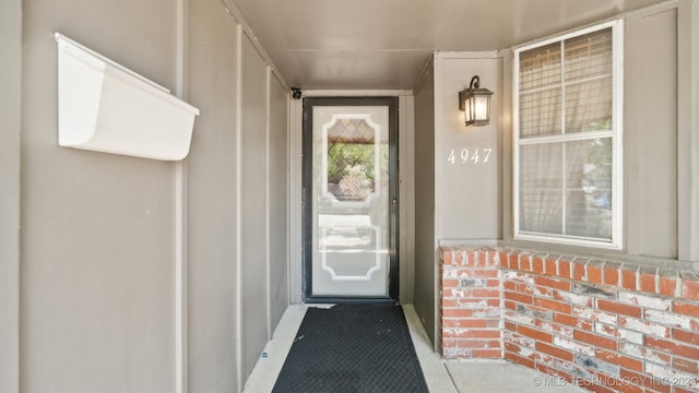 entrance to property with brick siding