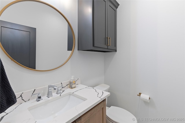 bathroom with toilet and vanity