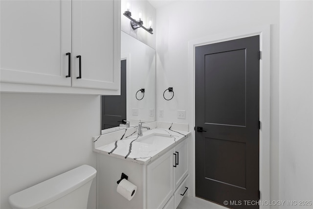 half bath with toilet and vanity