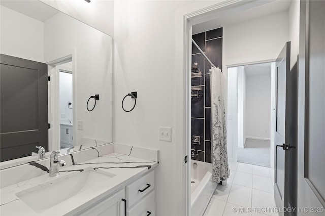 full bathroom featuring tile patterned flooring, shower / bath combo with shower curtain, and vanity