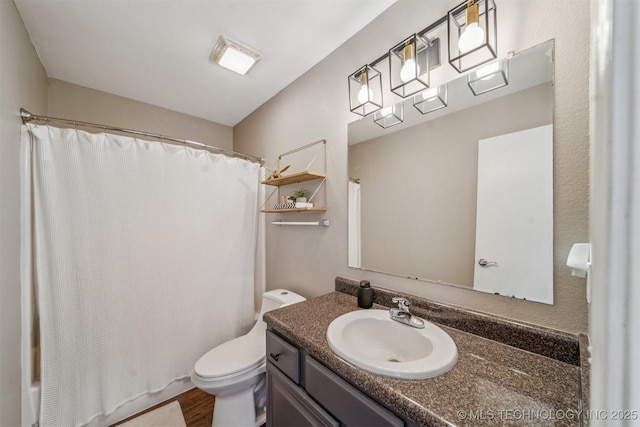 bathroom with shower / tub combo, toilet, wood finished floors, and vanity