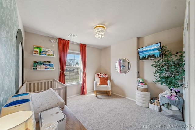 carpeted bedroom with visible vents and baseboards