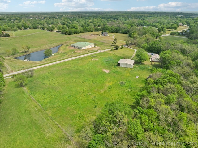 birds eye view of property featuring a wooded view, a rural view, and a water view