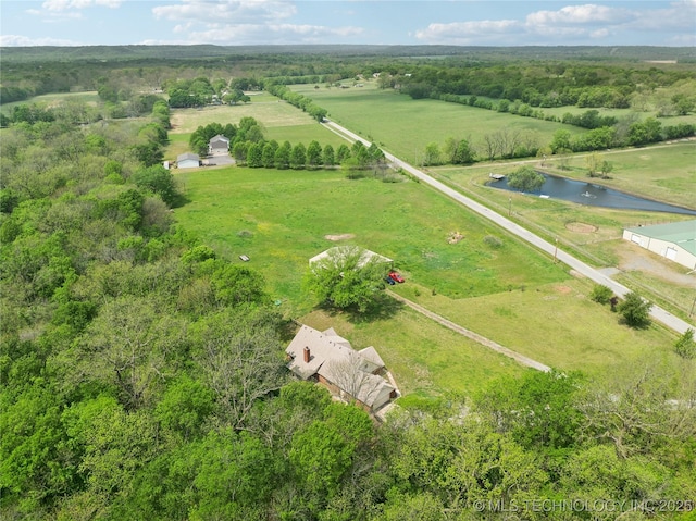 birds eye view of property featuring a rural view and a water view