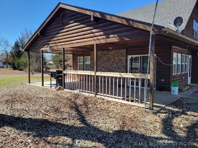 view of property exterior with a patio area