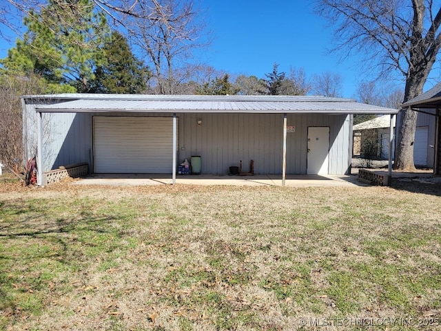 garage with a garage and dirt driveway