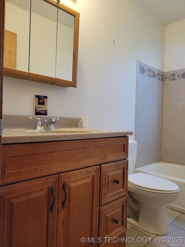 full bath with vanity, tile patterned floors, and toilet