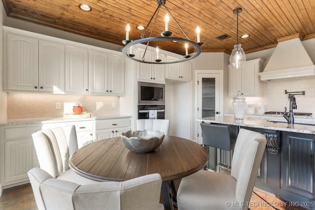 dining area with visible vents, wooden ceiling, and crown molding