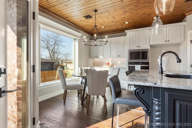 dining space featuring visible vents, wooden ceiling, dark wood-type flooring, and ornamental molding