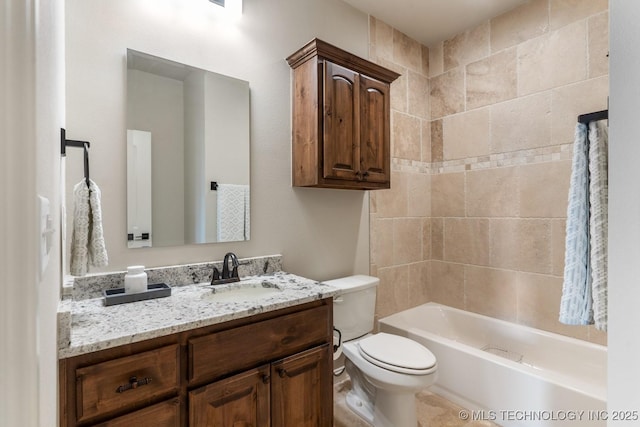 bathroom featuring vanity, shower / bathing tub combination, and toilet