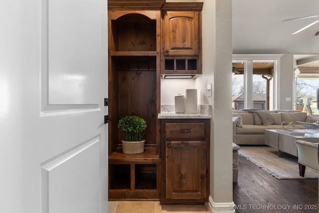 mudroom featuring wood finished floors and ceiling fan