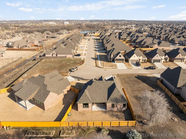 birds eye view of property with a residential view