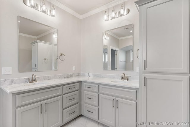 bathroom featuring double vanity, marble finish floor, ornamental molding, and a sink