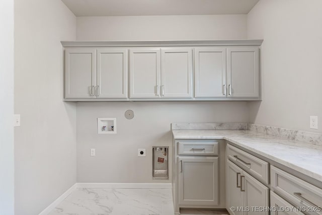 washroom featuring baseboards, hookup for a washing machine, cabinet space, electric dryer hookup, and marble finish floor