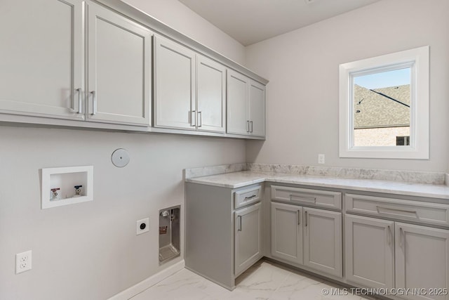 laundry area featuring baseboards, cabinet space, electric dryer hookup, washer hookup, and marble finish floor