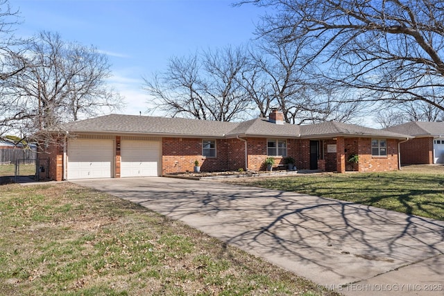 single story home with brick siding, a chimney, concrete driveway, and a front yard