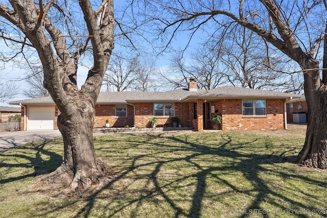 ranch-style house featuring a front lawn, concrete driveway, an attached garage, brick siding, and a chimney