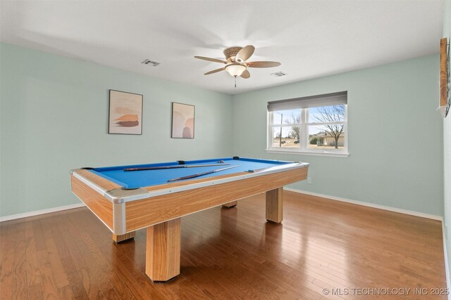 playroom with a ceiling fan, wood finished floors, visible vents, and baseboards