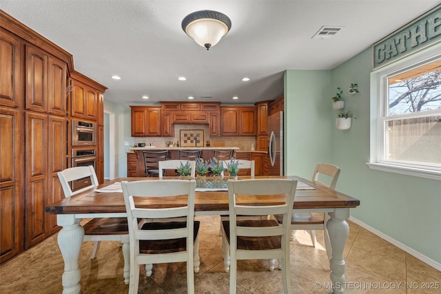 dining area featuring recessed lighting, visible vents, baseboards, and light tile patterned floors