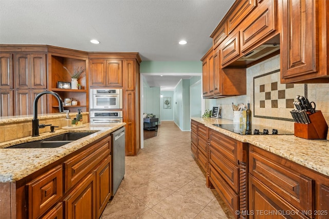 kitchen featuring a sink, open shelves, light stone counters, black electric stovetop, and dishwasher