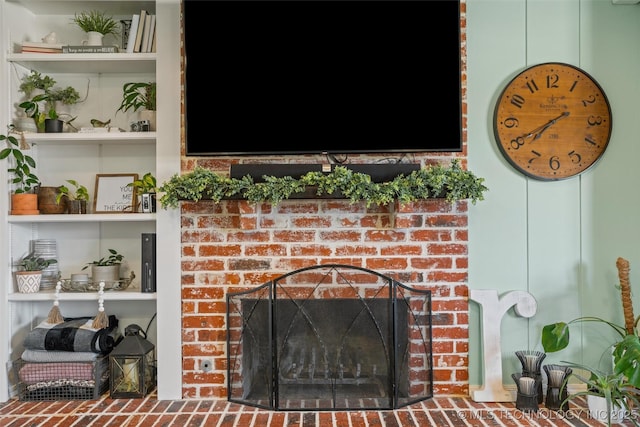 room details featuring a brick fireplace