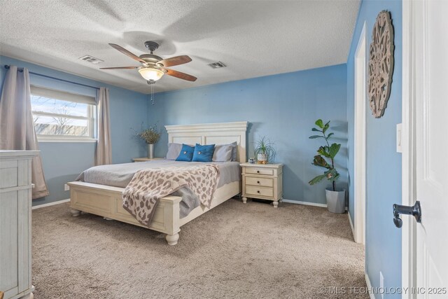 bedroom featuring visible vents, baseboards, a ceiling fan, and carpet floors