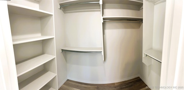 spacious closet with wood finished floors