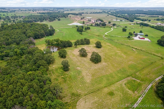 birds eye view of property with a rural view