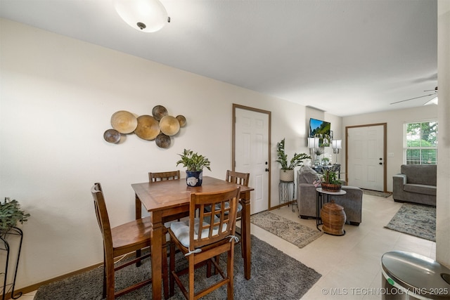 dining room with baseboards and a ceiling fan