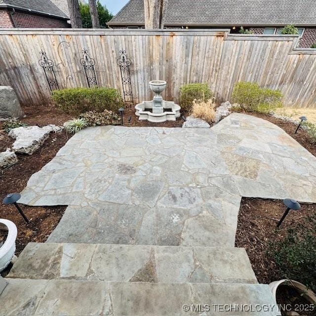 view of patio with fence