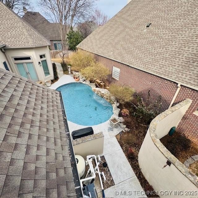 view of swimming pool featuring a fenced in pool