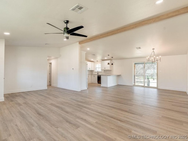 unfurnished living room with visible vents, vaulted ceiling with beams, baseboards, light wood-type flooring, and ceiling fan with notable chandelier