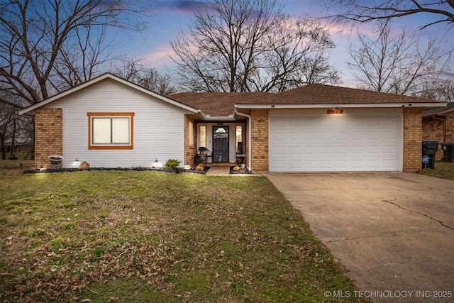 ranch-style home featuring brick siding, concrete driveway, a front yard, and a garage