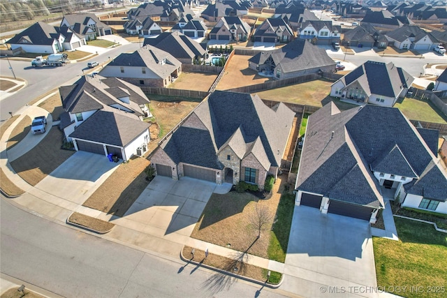 birds eye view of property with a residential view