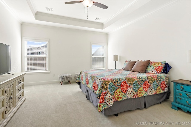 carpeted bedroom featuring visible vents, a raised ceiling, multiple windows, and ornamental molding