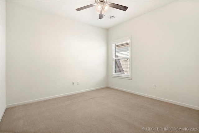 unfurnished room featuring visible vents, baseboards, light colored carpet, and a ceiling fan