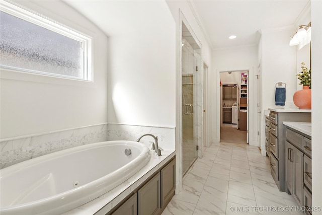 full bath with a walk in closet, a garden tub, marble finish floor, a stall shower, and vanity