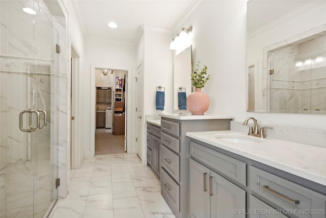 bathroom with a sink, marble finish floor, and crown molding