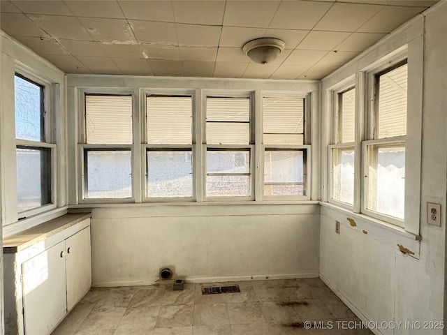 unfurnished sunroom with visible vents