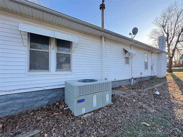 view of side of home with cooling unit