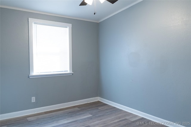 empty room featuring ornamental molding, a ceiling fan, baseboards, and wood finished floors