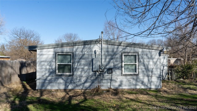 view of property exterior with fence