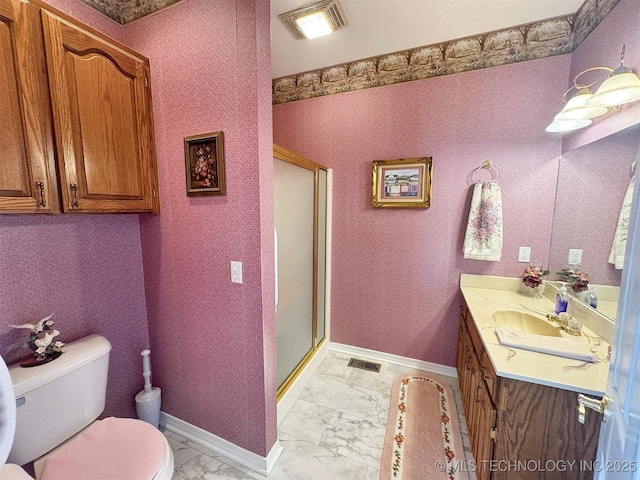 full bathroom with marble finish floor, toilet, wallpapered walls, and baseboards