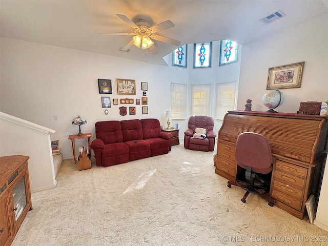 carpeted home office featuring visible vents and ceiling fan