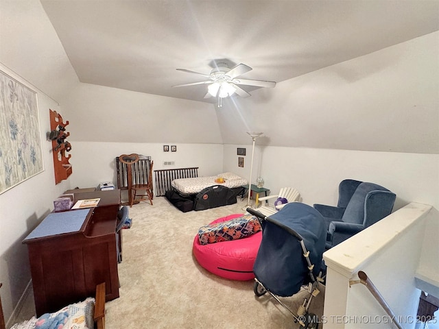 bedroom with vaulted ceiling, carpet flooring, and a ceiling fan