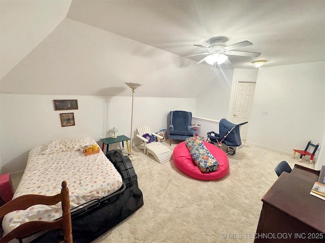 carpeted bedroom with baseboards, a ceiling fan, and vaulted ceiling