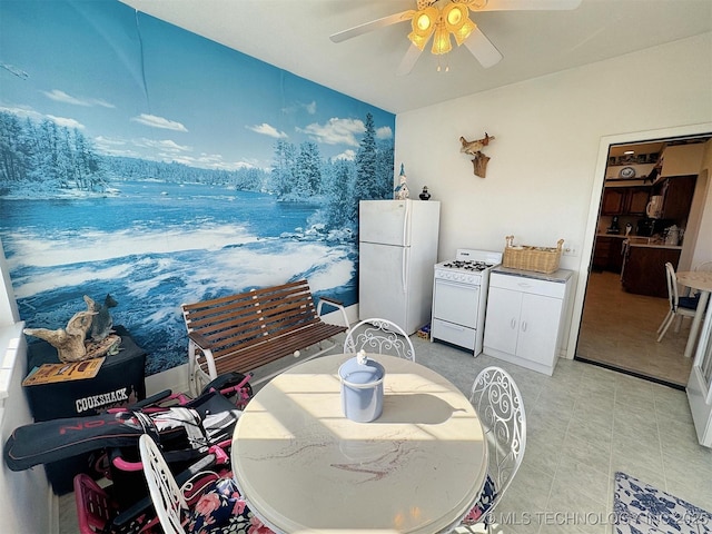 dining space with a ceiling fan